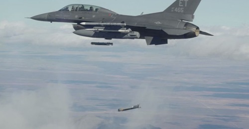 Collaborative Small Diameter Bombs (CSDBs) are launched from the wing of an F-16 fighter from the Air Force Test Center's 96th Test Wing at Eglin Air Force Base, Florida. Four of the bombs were dropped during the second flight demonstration of the Gold...