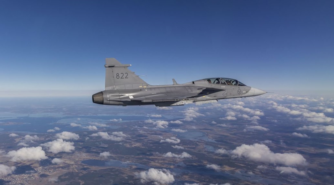 The bright silver panel that was 3D printed can be seen attached to the aft section of the Gripen D testbed during its first flight earlier in March.