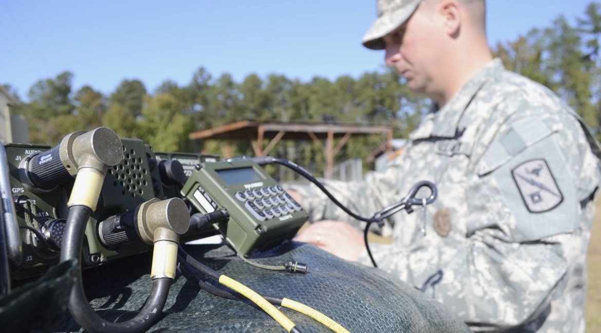 A US Army radio operator-maintainer works on a AN/PRC 1510, high-frequency radio at Fort Gordon, Georgia.