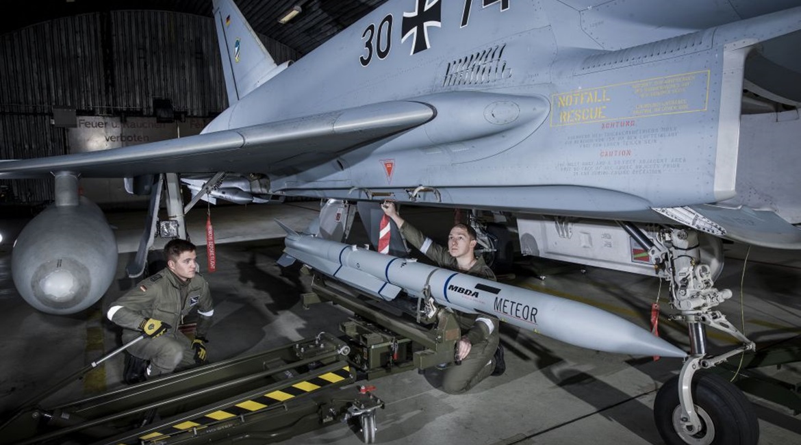 Luftwaffe ground crew load a Meteor BVRAAM aboard a Eurofighter combat aircraft. The service has now begun fielding the missile with the introduction of the P2Eb software on the aircraft.