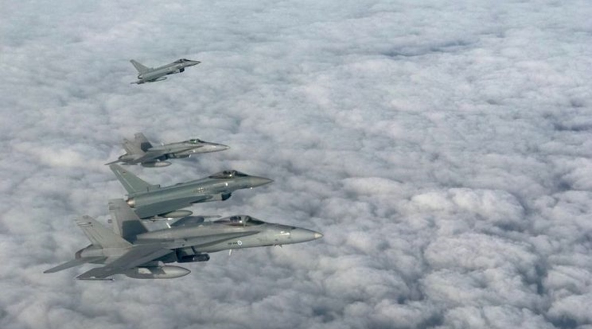 An archive image showing BAP Eurofighters conducting joint training drills with NATO partner Finland's F/A-18s.