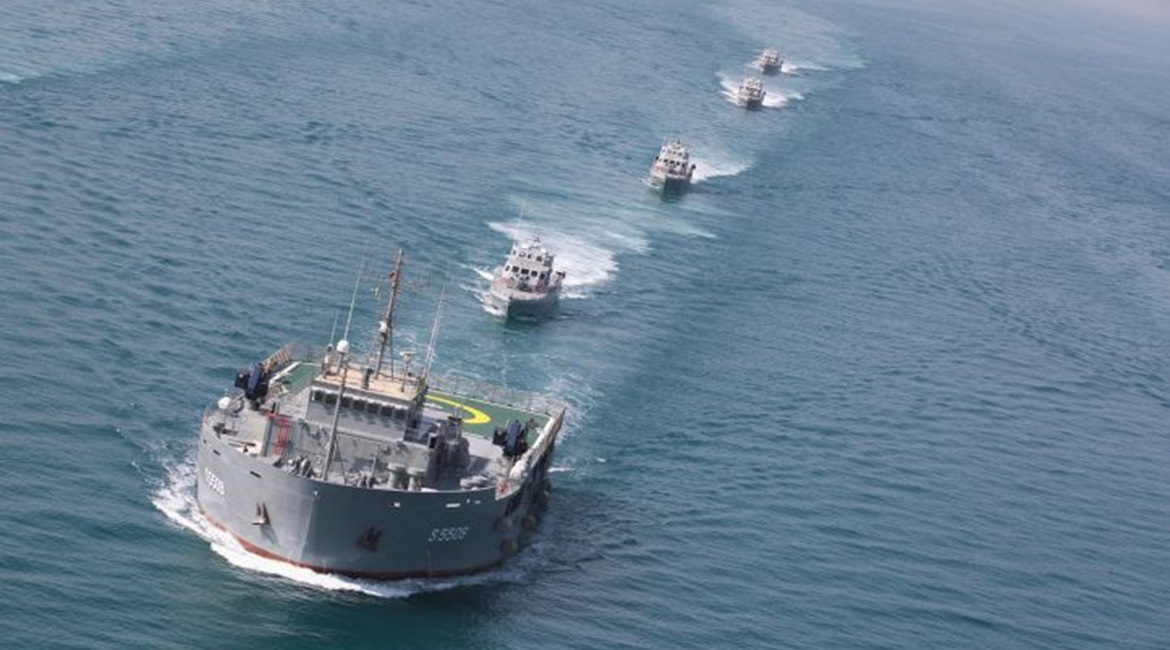 The Kuwait Naval Force's uses the oil rig replenishment and accommodation ship 
        
         (foreground) as an auxiliary transport vessel.