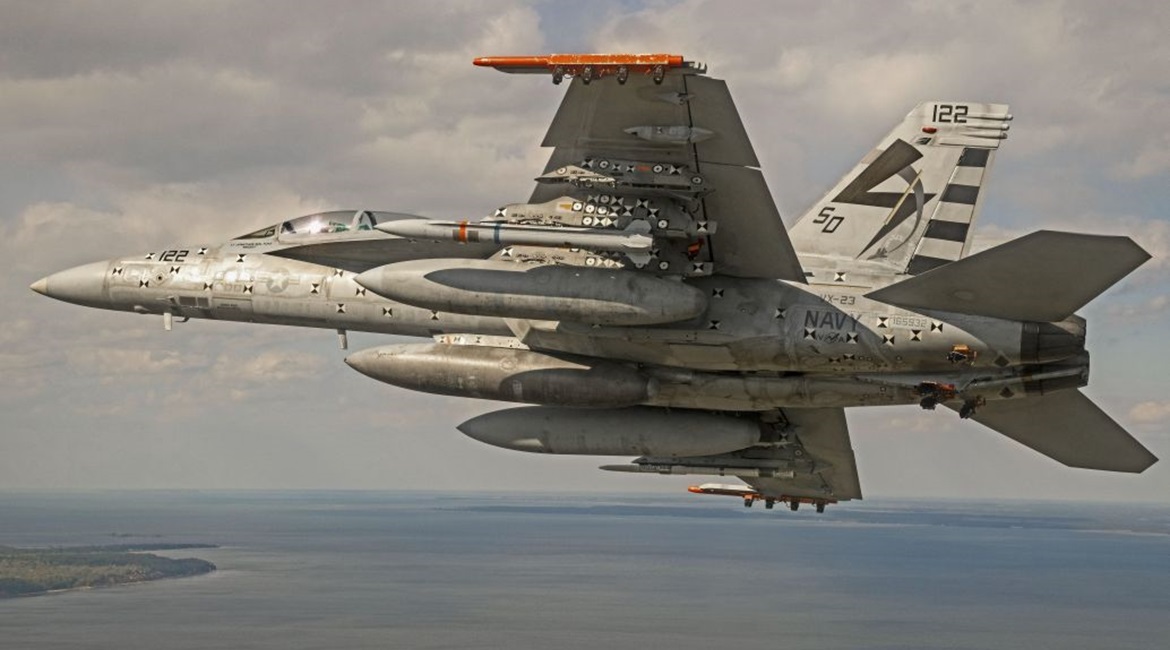 A US Navy F/A-18E/F Super Hornet conducts a captive-carriage flight with an Advanced Anti-Radiation Guided Missile - Extended Range (AARGM-ER) Separation Test Vehicle at the Naval Air Warfare Center Atlantic Test Ranges in Patuxent River, Maryland, on ...